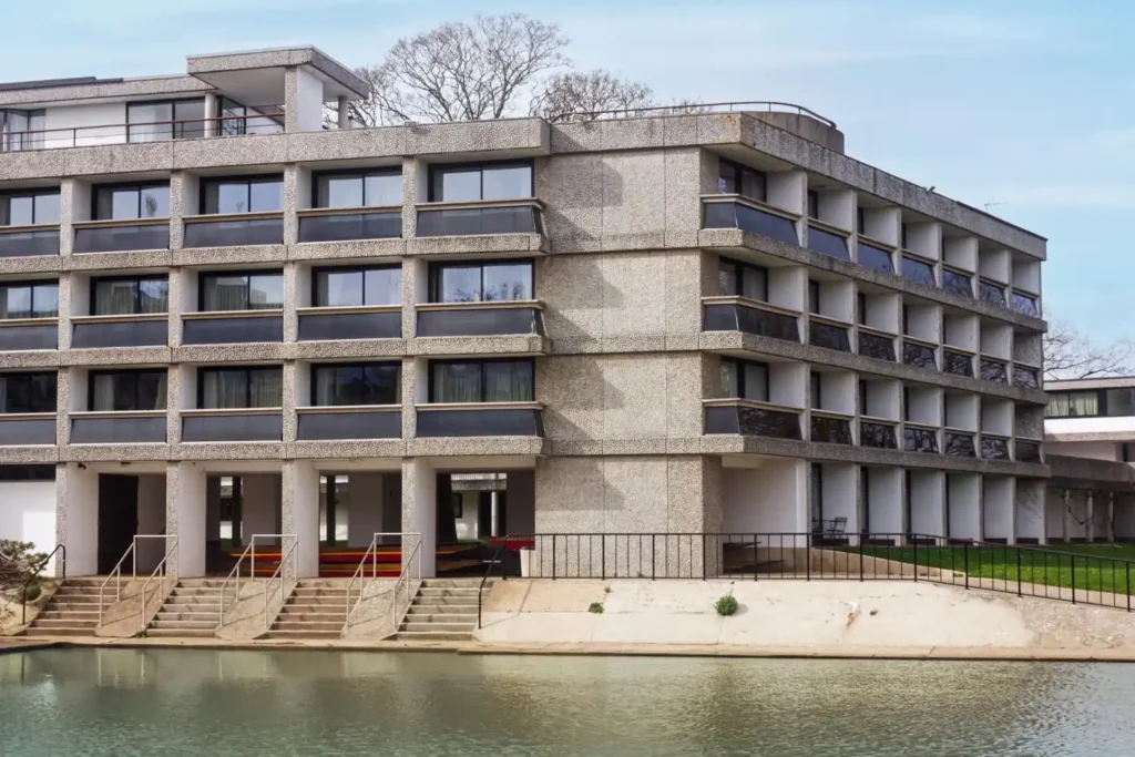 An image of Wolfson College Oxford where Original Fields of Architecture Oxford delivered the decarbonisation project for the college. This image shows the externals of the college in the sunlight.